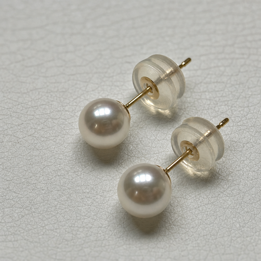 Close-up of 5.5–6.0 mm Akoya pearl stud earrings and 18K yellow gold posts